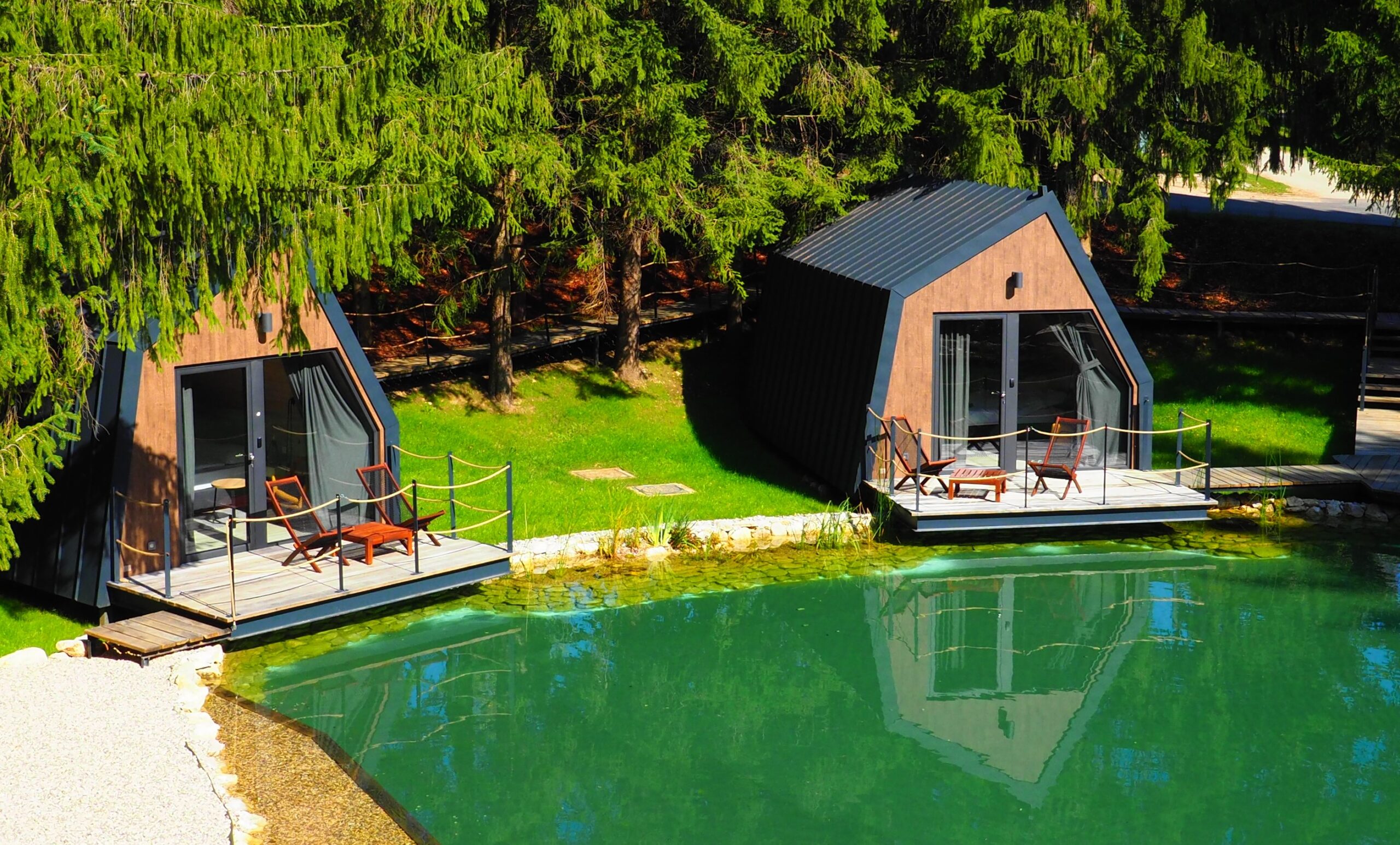 Beautiful views of a lake and some houses at Plitvice Holiday Resort