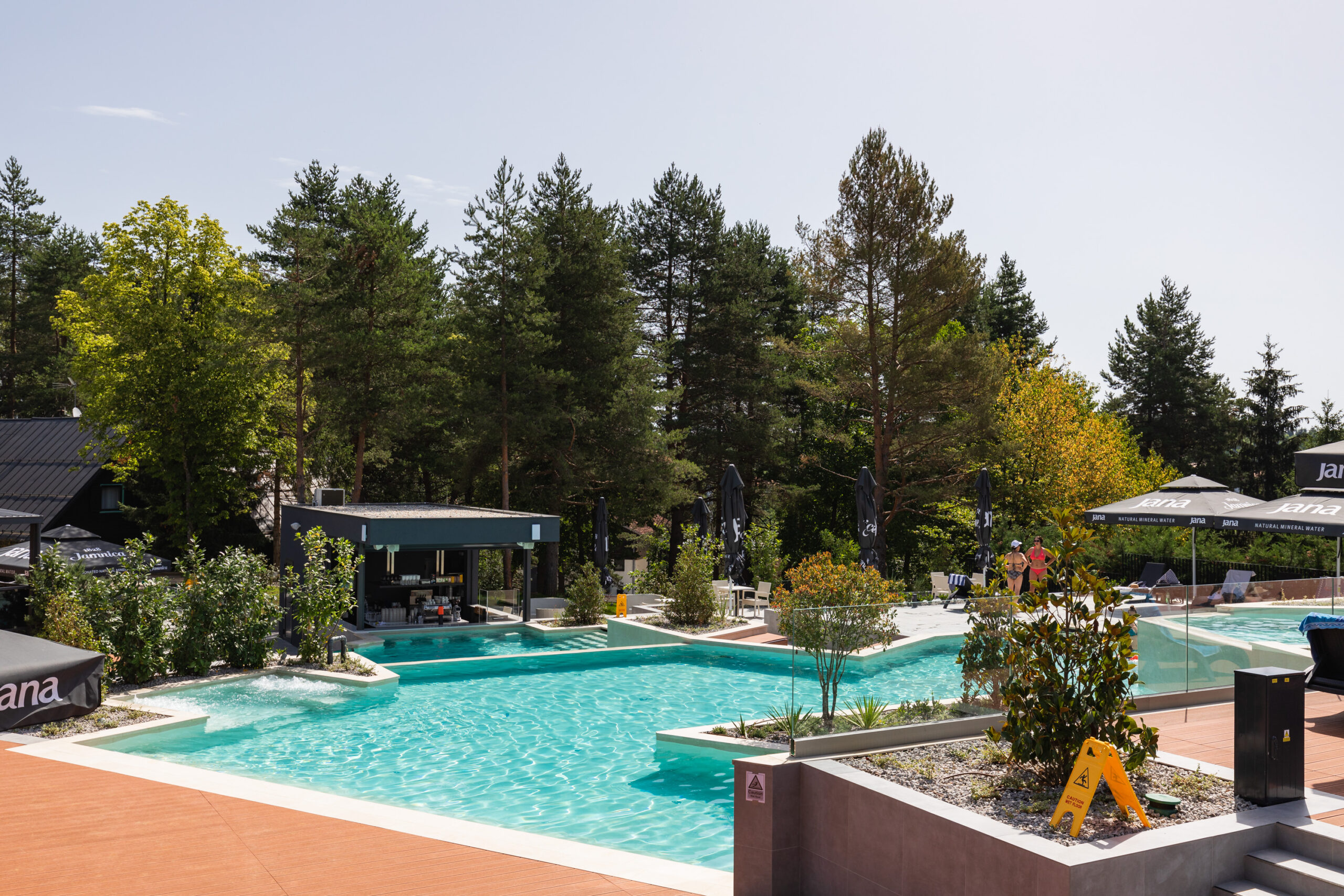 A pool and a poolside bar at Plitvice Holiday Resort