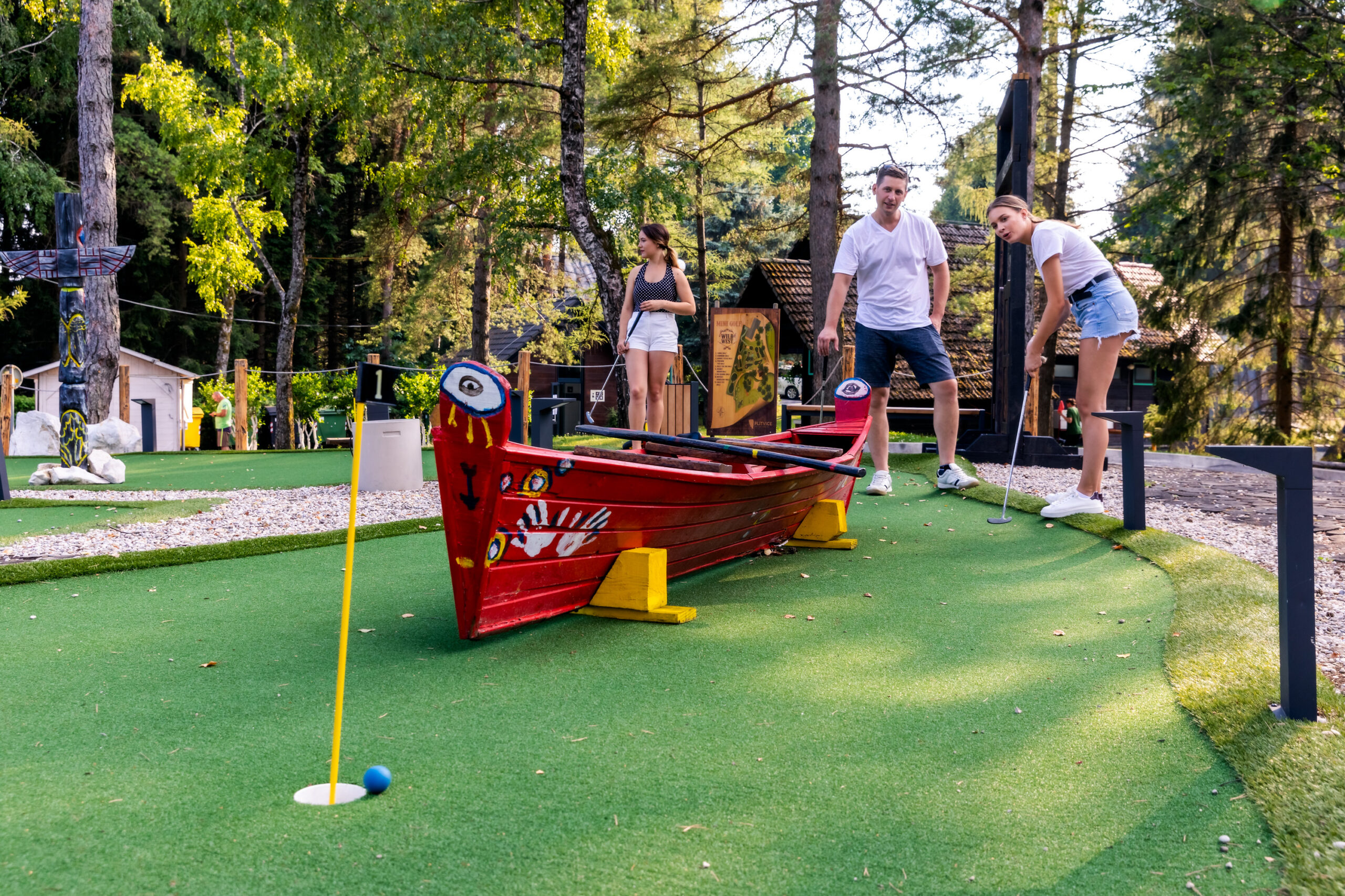 Young people playing mini golf at Plitvice Holiday Resort